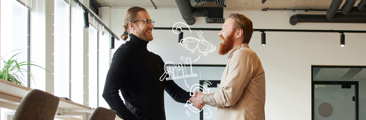 Side view of entrepreneur in casual clothes shaking hands with bearded and tattooed business partner