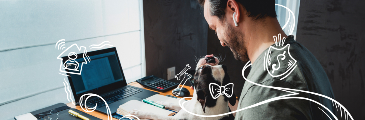 man on laptop with dog on lap